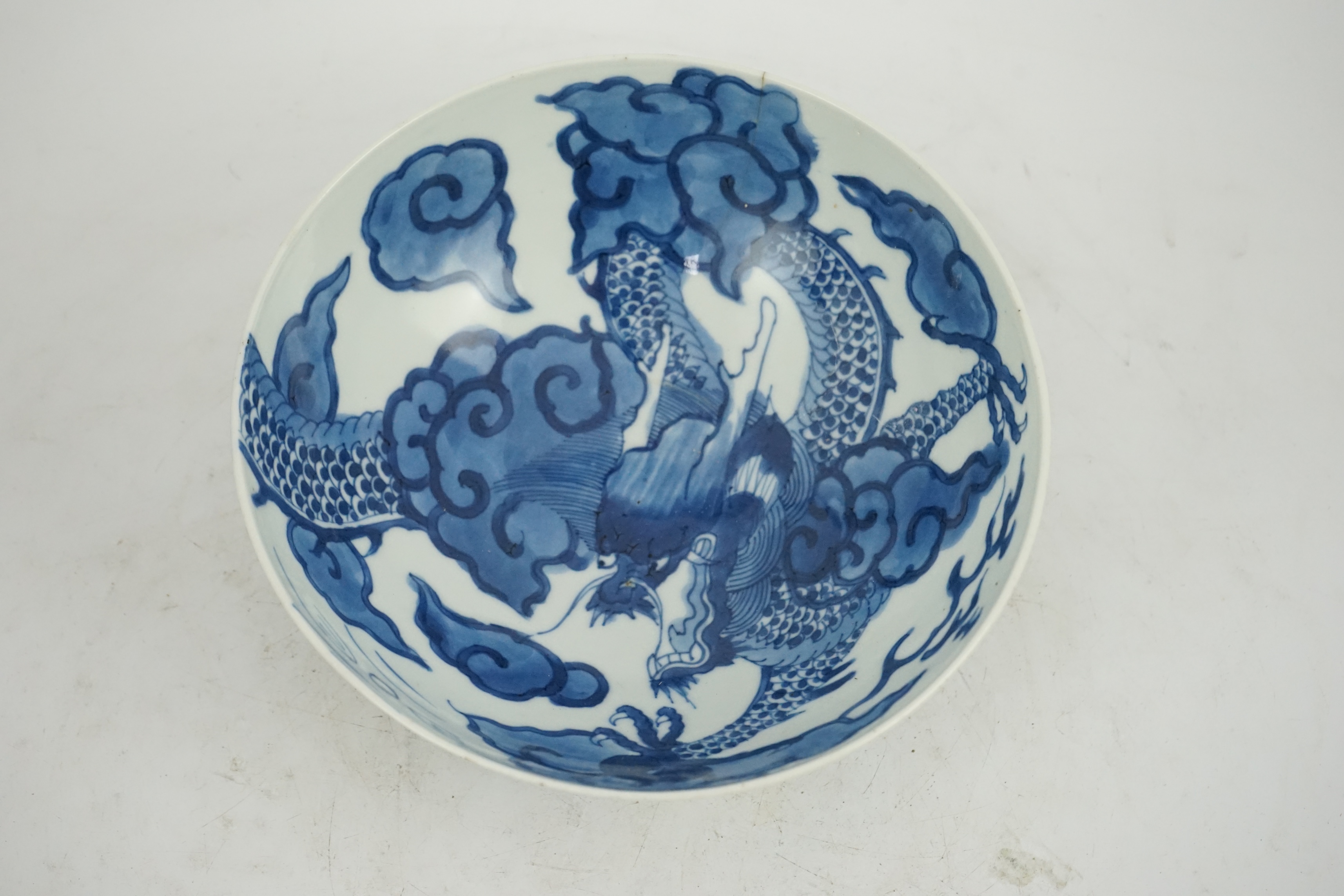 A Chinese blue and white ‘cloud and dragon’ bowl, Yongzheng mark and period (1723-35)